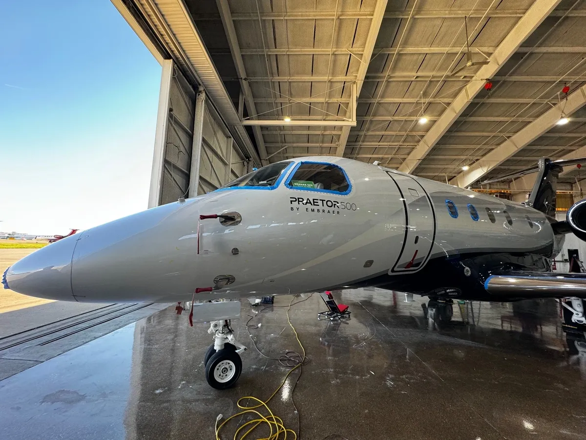 Private jet inside an airport hangar.