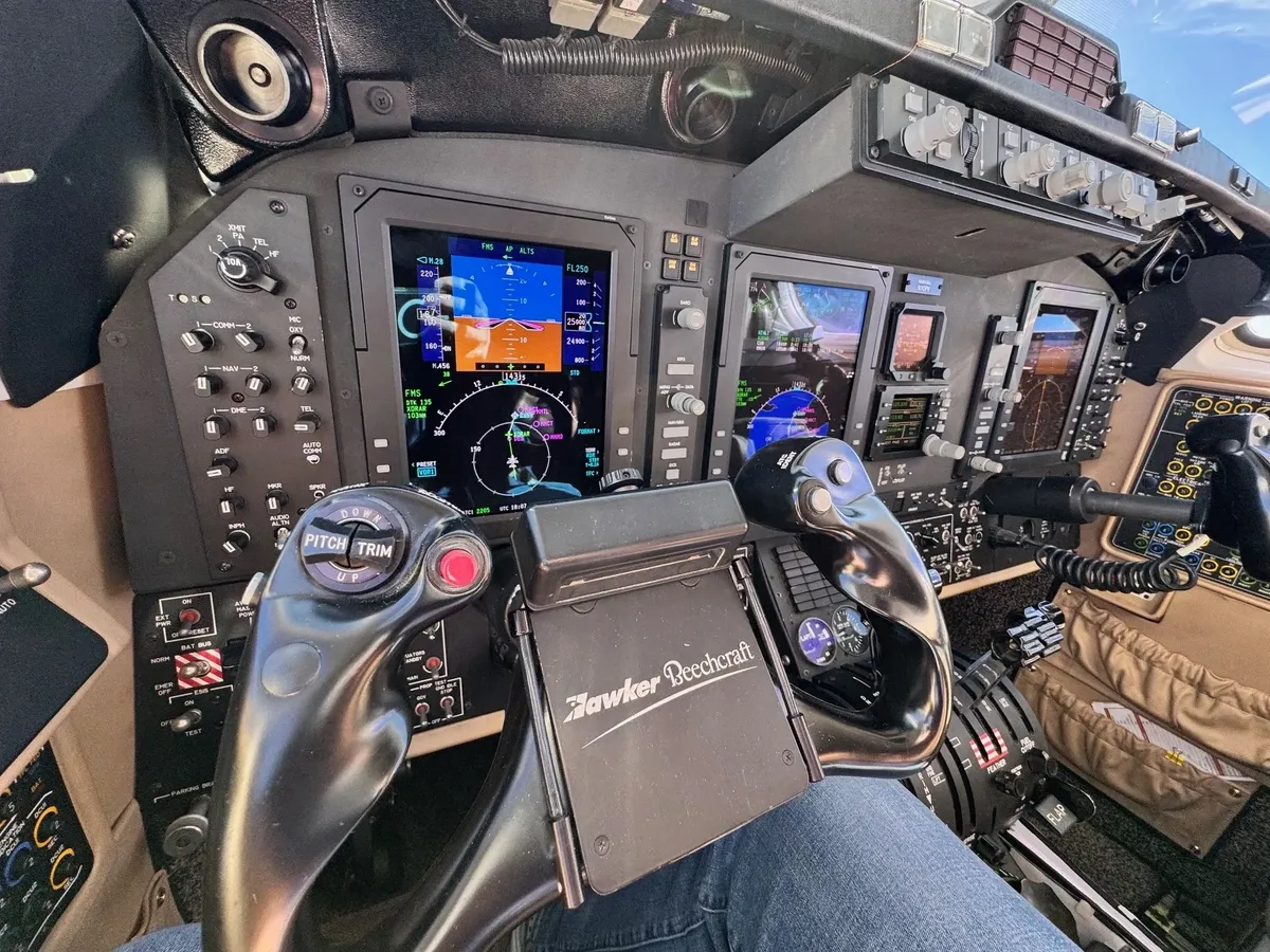 Airplane cockpit with digital flight instruments.